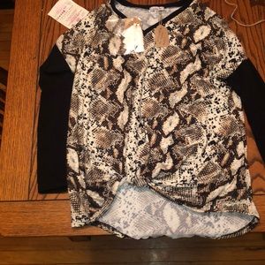 Snake print blouse and dangly earrings